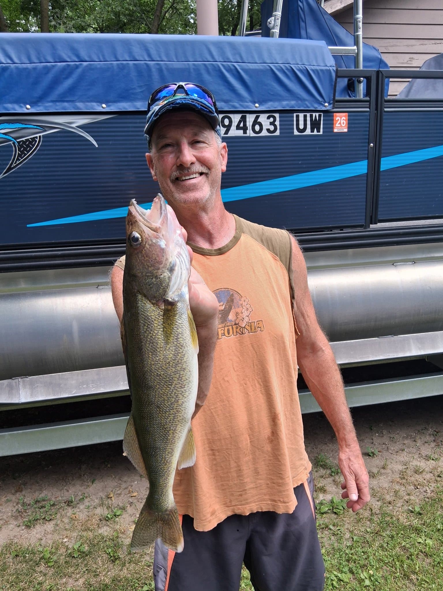 Smiling angler holding a fish